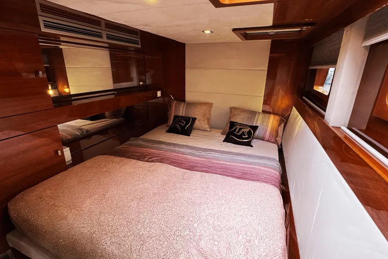 Talon Yacht Photos Pics Luxurious bedroom interior of 2011 Sunreef 62 yacht with elegant wood finishes.