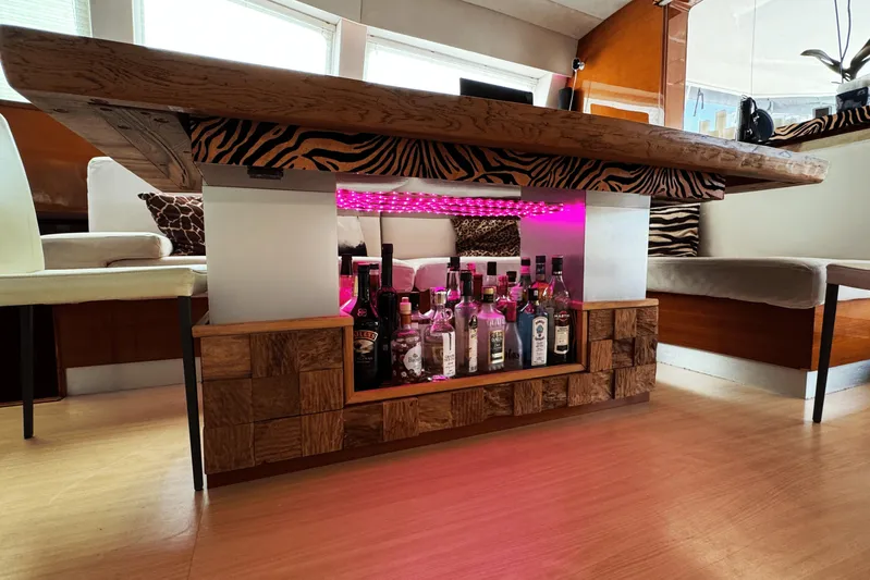 Talon Yacht Photos Pics Luxurious Sunreef 62 yacht interior bar with zebra print and illuminated liquor display, 2011 model.
