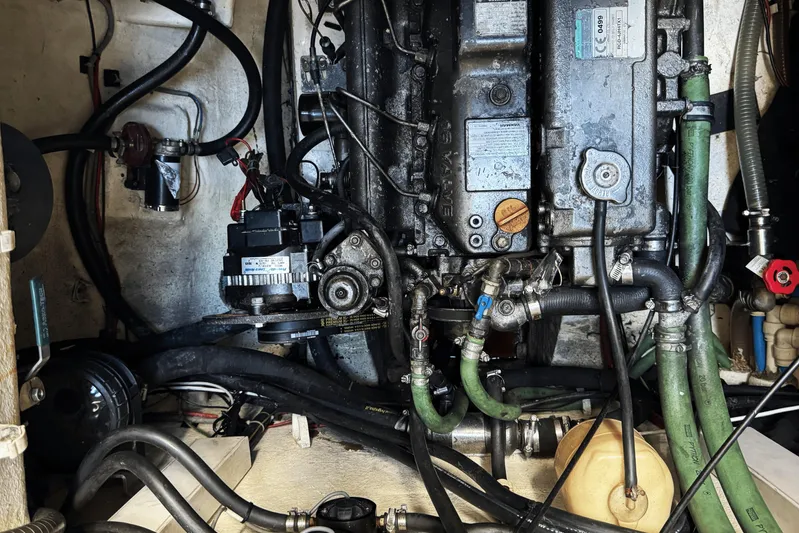 Talon Yacht Photos Pics Engine compartment of a 2011 Sunreef 62 yacht, showcasing mechanical components and hoses.