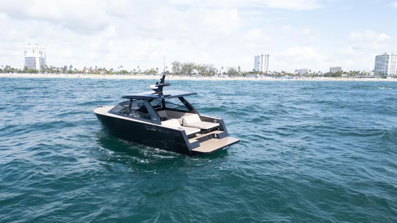  Yacht Photos Pics 2024 Colnago C38 OPEN yacht cruising on ocean near city skyline.