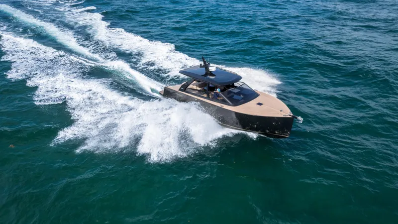  Yacht Photos Pics 2024 Colnago C38 OPEN yacht cruising on open water, creating a dynamic wake.