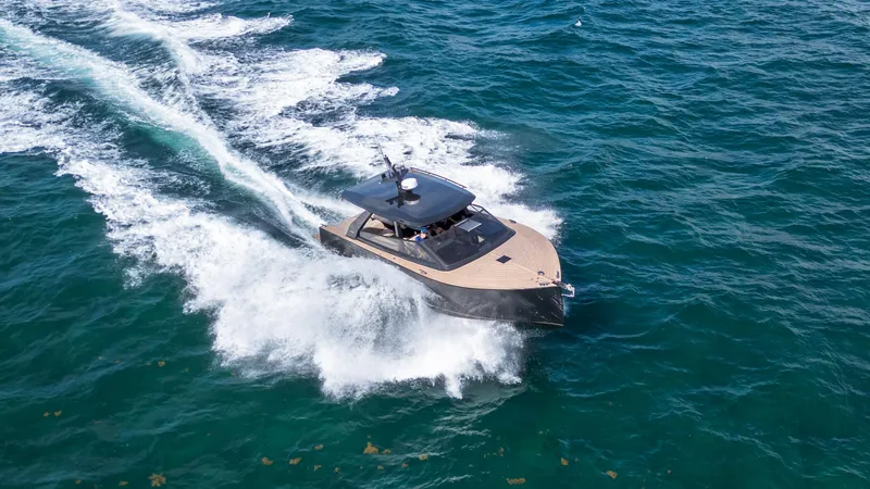  Yacht Photos Pics 2024 Colnago C38 OPEN yacht cruising on open water, creating a dynamic wake.