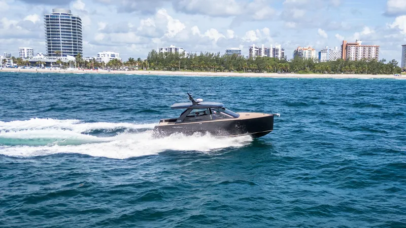  Yacht Photos Pics 2024 Colnago C38 OPEN yacht cruising on ocean near city skyline.