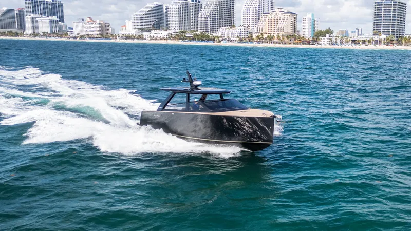  Yacht Photos Pics 2024 Colnago C38 OPEN yacht cruising near a city skyline.