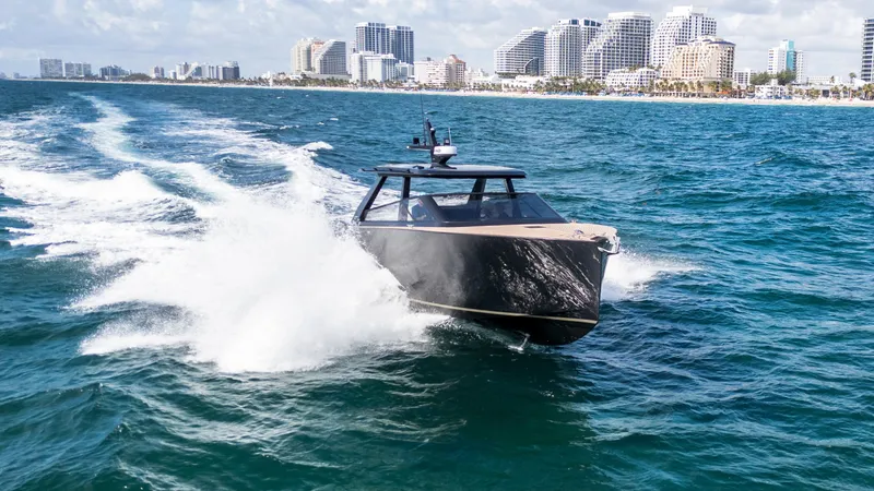  Yacht Photos Pics 2024 Colnago C38 OPEN yacht cruising on ocean near city skyline.