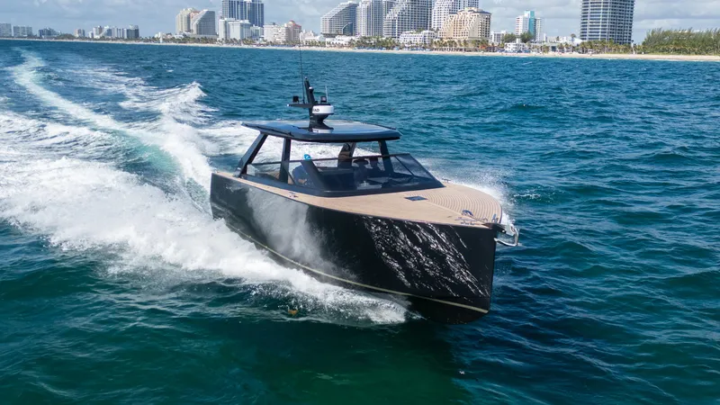  Yacht Photos Pics Sleek 2024 Colnago C38 OPEN yacht cruising near a city skyline.