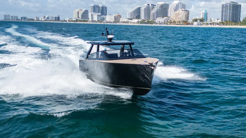  Yacht Photos Pics 2024 Colnago C38 OPEN yacht cruising on ocean near city skyline.