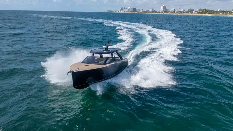  Yacht Photos Pics 2024 Colnago C38 OPEN boat cruising on ocean near city skyline.