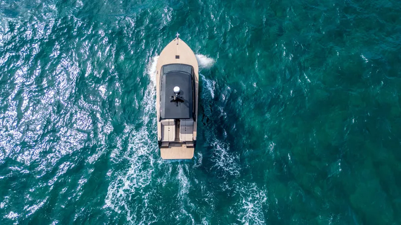  Yacht Photos Pics Aerial view of 2024 Colnago C38 OPEN yacht cruising in turquoise waters.