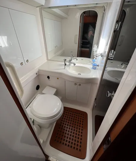  Yacht Photos Pics Luxurious bathroom in 1999 Nautor Swan 68 yacht, featuring modern fixtures and elegant design.