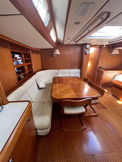  Yacht Photos Pics Luxurious interior of a 1999 Nautor Swan 68 yacht with elegant wood finishes.