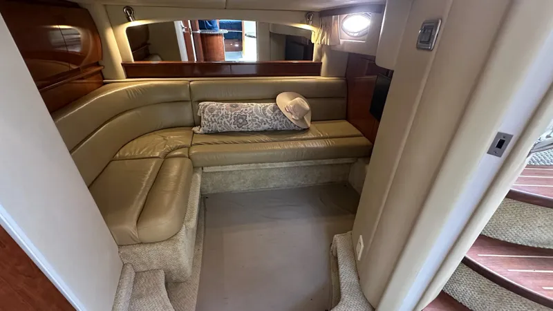  Yacht Photos Pics Luxurious interior of 2006 Sea Ray 44 Sundancer with beige leather seating and elegant decor.