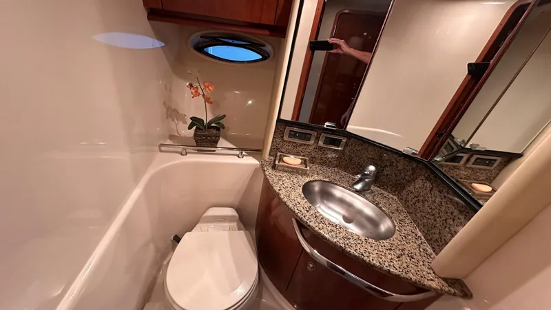  Yacht Photos Pics Luxurious bathroom in 2006 Sea Ray 44 Sundancer yacht with granite countertop and porthole.