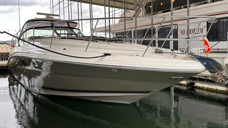  Yacht Photos Pics 2006 Sea Ray 44 Sundancer yacht docked in marina, side view.