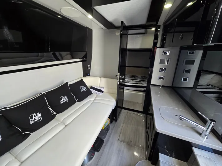 Lady Mash Yacht Photos Pics Luxurious interior of 2021 HCB 65 Estrella yacht with modern seating and sleek design.