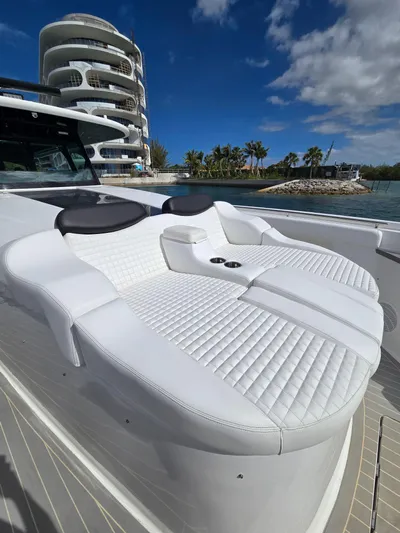Lady Mash Yacht Photos Pics Luxurious seating on 2021 HCB 65 Estrella yacht, with modern architecture in the background.