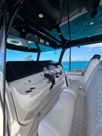 Lady Mash Yacht Photos Pics Interior of 2021 HCB 65 Estrella boat with luxurious seating and modern dashboard.