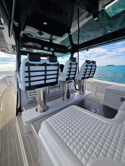 Lady Mash Yacht Photos Pics 2021 HCB 65 Estrella luxury boat interior with plush seating and ocean view.