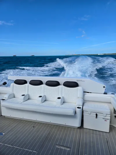 Lady Mash Yacht Photos Pics Luxury seating on 2021 HCB 65 Estrella yacht cruising through blue ocean waters.