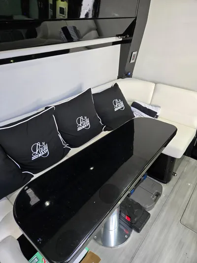 Lady Mash Yacht Photos Pics Luxurious interior of 2021 HCB 65 Estrella with sleek black table and custom cushions.