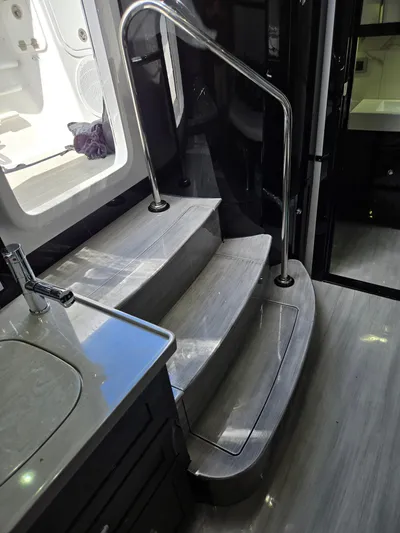 Lady Mash Yacht Photos Pics Interior stairs of 2021 HCB 65 Estrella yacht with sleek design and modern finishes.