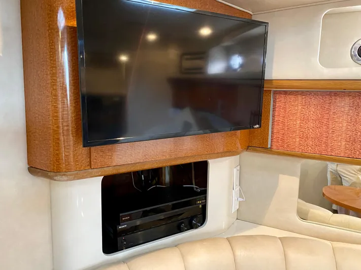  Yacht Photos Pics Interior of 1996 Sea Ray 450 Sundancer with mounted TV and entertainment system.