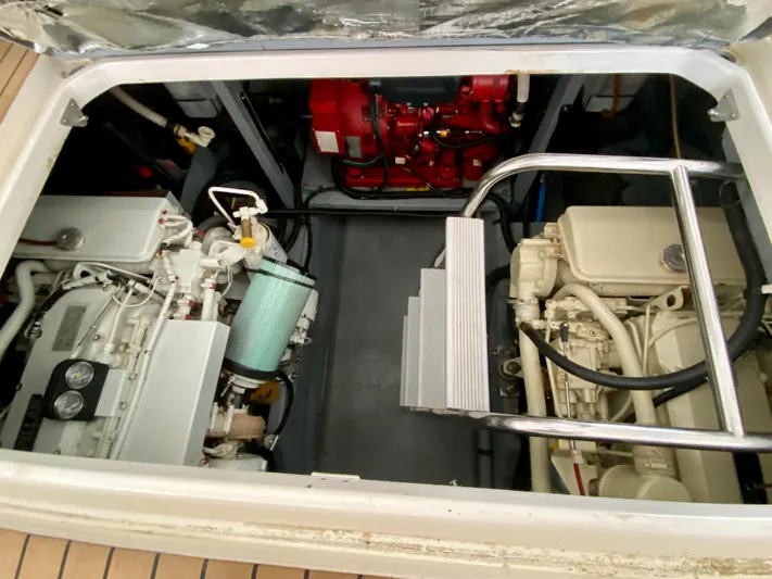  Yacht Photos Pics Engine compartment of 1996 Sea Ray 450 Sundancer, showcasing dual engines and mechanical components.