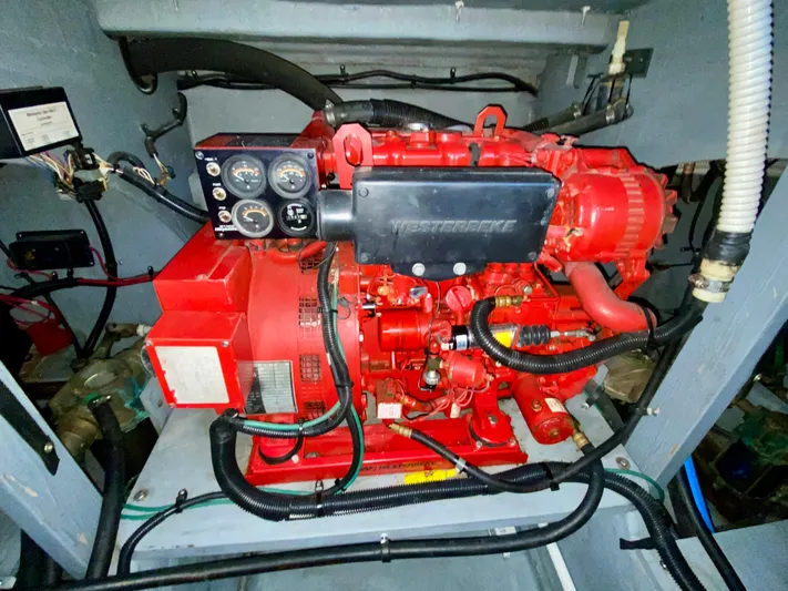  Yacht Photos Pics Engine compartment of a 1996 Sea Ray 450 Sundancer with red machinery and control panel.