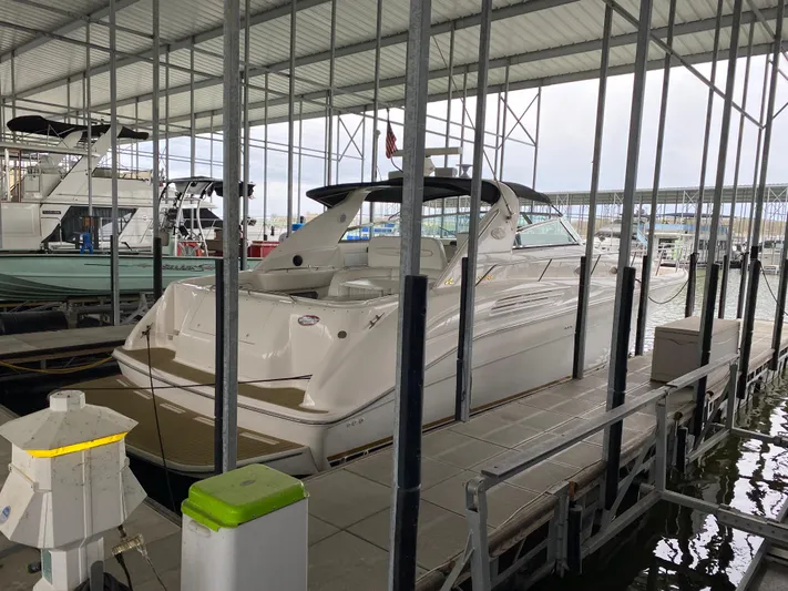  Yacht Photos Pics 1996 Sea Ray 450 Sundancer docked in a covered marina.