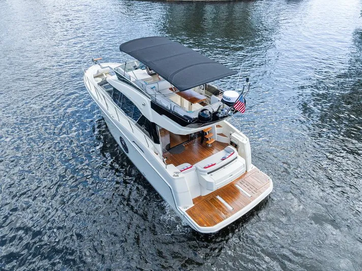 Have Another Yacht Photos Pics 2016 Beneteau Monte Carlo 4 yacht on water, featuring a spacious deck and sleek design.