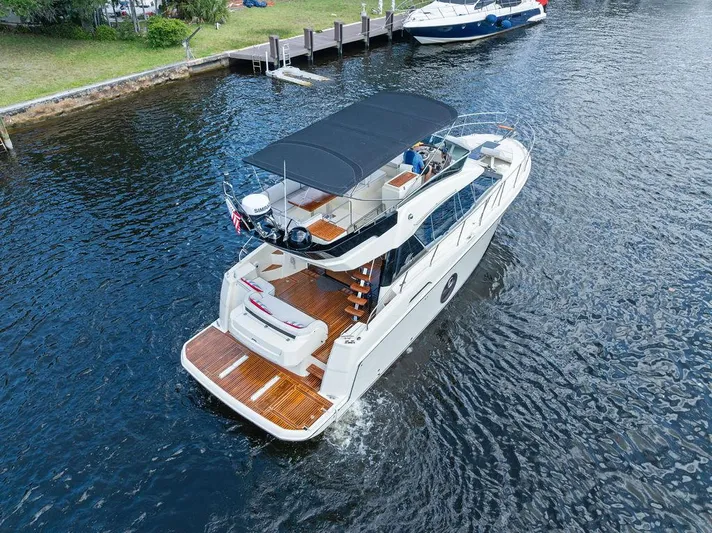 Have Another Yacht Photos Pics 2016 Beneteau Monte Carlo 4 yacht cruising on a calm river.