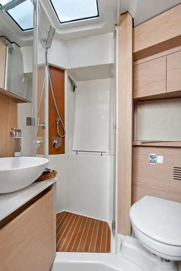 Have Another Yacht Photos Pics Luxurious bathroom in 2016 Beneteau Monte Carlo 4 yacht with modern fixtures and skylight.