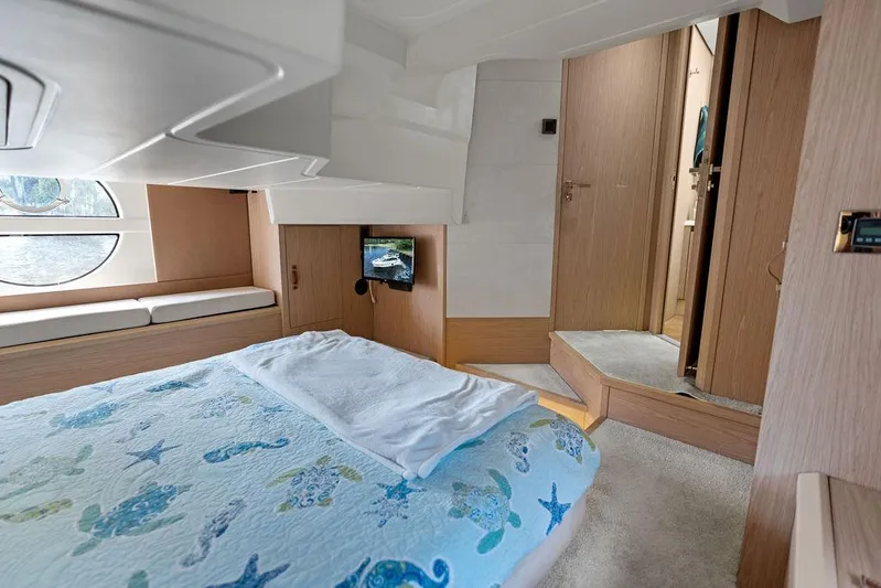 Have Another Yacht Photos Pics Luxurious cabin interior of 2016 Beneteau Monte Carlo 4 yacht with nautical-themed bedding.