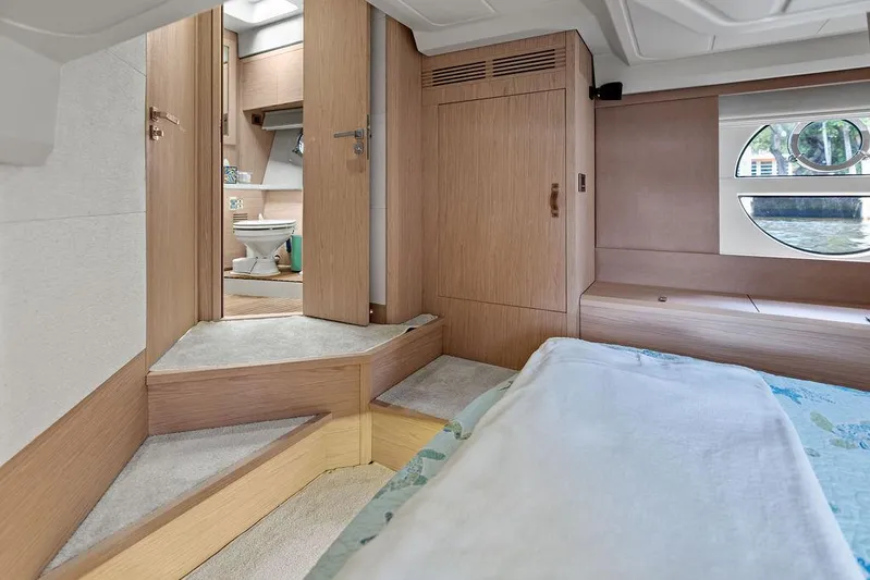 Have Another Yacht Photos Pics Interior of 2016 Beneteau Monte Carlo 4 yacht, featuring bedroom and bathroom with modern wood finish.