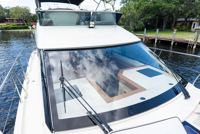 Have Another Yacht Photos Pics 2016 Beneteau Monte Carlo 4 yacht with sleek design, docked near lush greenery.