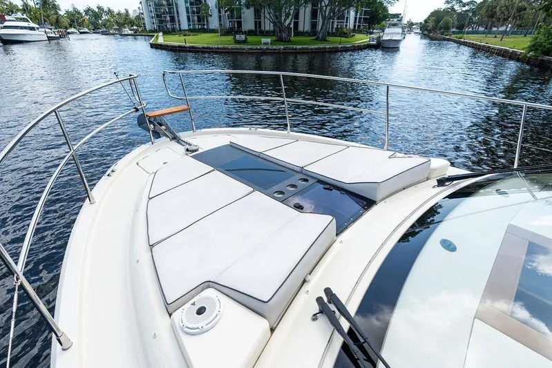 Have Another Yacht Photos Pics 2016 Beneteau Monte Carlo 4 yacht bow with sun pads on a calm waterway.