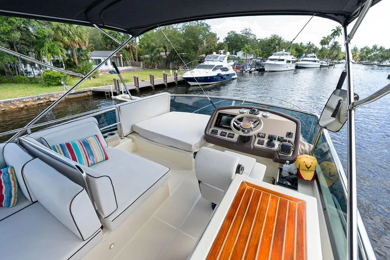 Have Another Yacht Photos Pics 2016 Beneteau Monte Carlo 4 yacht cockpit with seating, helm, and waterfront view.