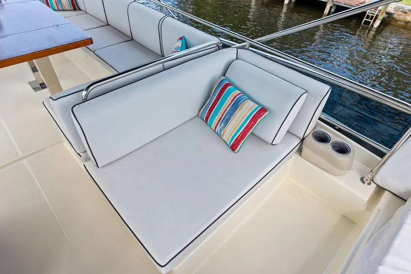 Have Another Yacht Photos Pics Luxurious seating area on 2016 Beneteau Monte Carlo 4 yacht with striped cushion.