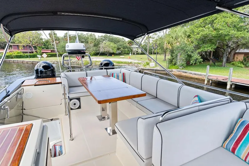 Have Another Yacht Photos Pics Luxurious 2016 Beneteau Monte Carlo 4 yacht with spacious seating and elegant wooden table.