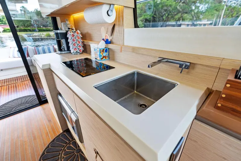 Have Another Yacht Photos Pics Modern kitchen area in a 2016 Beneteau Monte Carlo 4 yacht, featuring sleek countertops and appliances.