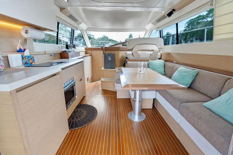 Have Another Yacht Photos Pics 2016 Beneteau Monte Carlo 4 yacht interior with modern kitchen and cozy seating area.