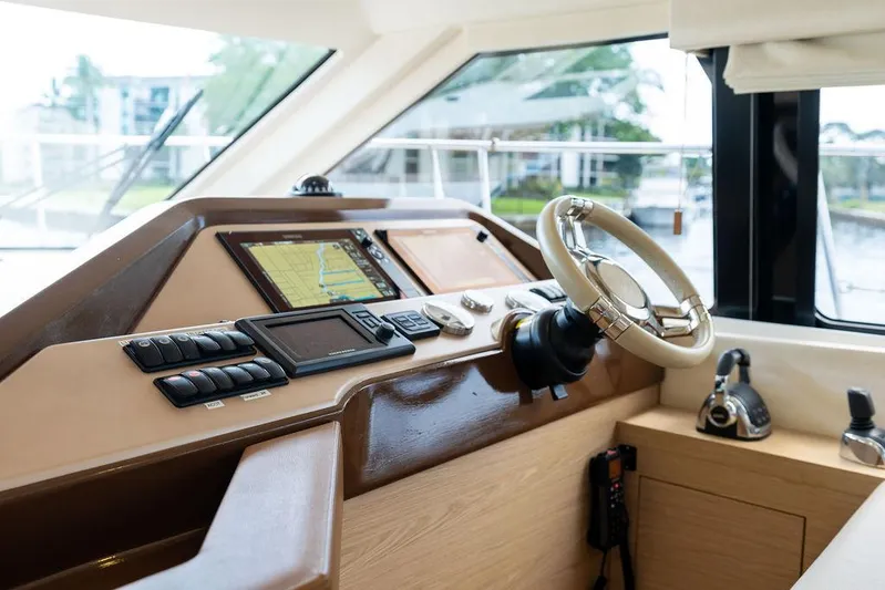 Have Another Yacht Photos Pics 2016 Beneteau Monte Carlo 4 yacht helm with modern navigation equipment and steering wheel.