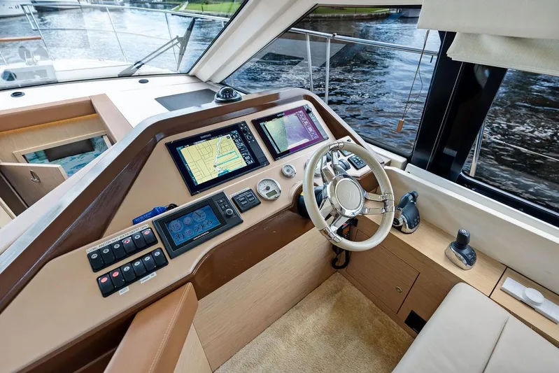 Have Another Yacht Photos Pics 2016 Beneteau Monte Carlo 4 yacht helm with navigation screens and steering wheel.