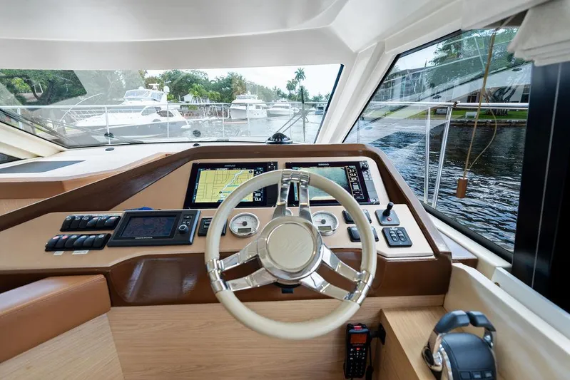 Have Another Yacht Photos Pics Helm of 2016 Beneteau Monte Carlo 4 yacht with modern navigation equipment and steering wheel.
