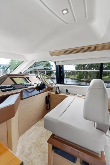 Have Another Yacht Photos Pics 2016 Beneteau Monte Carlo 4 helm station with modern controls and panoramic windows.