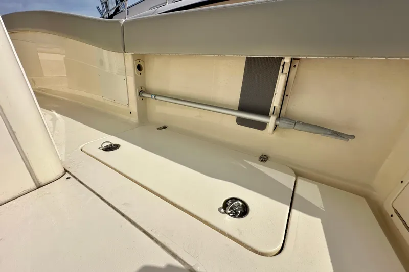  Yacht Photos Pics 2024 Scout 277 LXF boat interior storage compartment with sleek design and modern features.