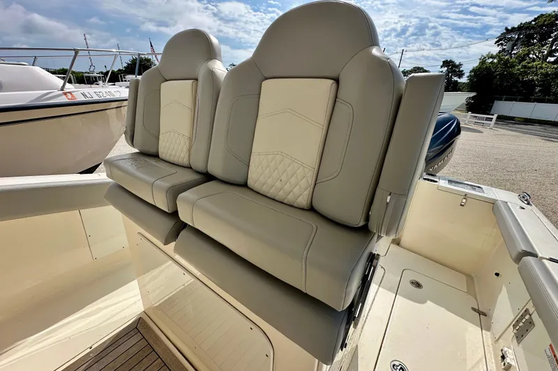  Yacht Photos Pics 2024 Scout 277 LXF boat seats with luxurious beige upholstery.