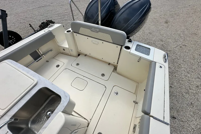  Yacht Photos Pics 2024 Scout 277 LXF boat interior with seating, storage, and sink.