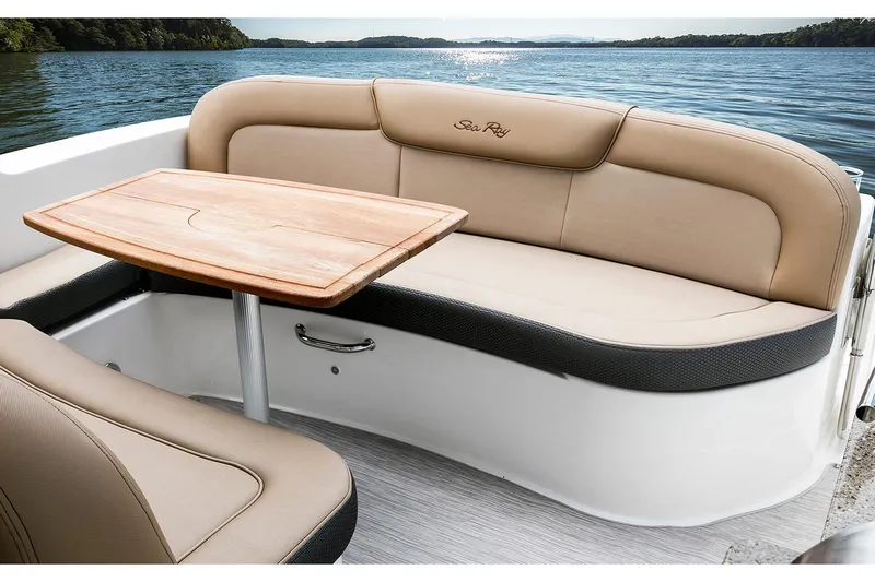  Yacht Photos Pics Manufacturer Provided Image: 2017 Sea Ray Sundancer 330 boat interior with tan seating and wooden table.
