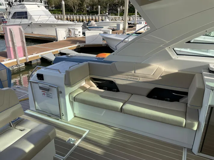  Yacht Photos Pics 2019 Formula 400 SSC yacht interior with beige seating at marina.
